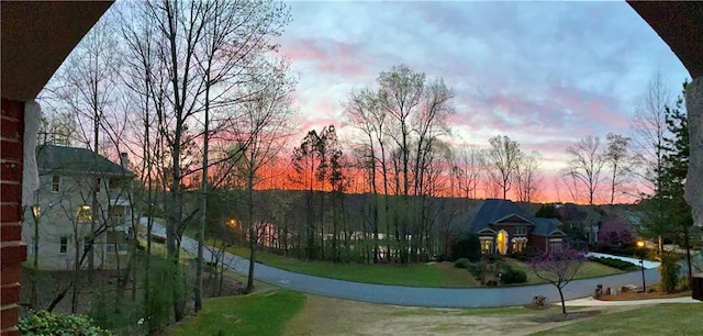 2287 Lake Ridge Ter, Lawrenceville, GA 30043 - yard at dusk featuring a lawn