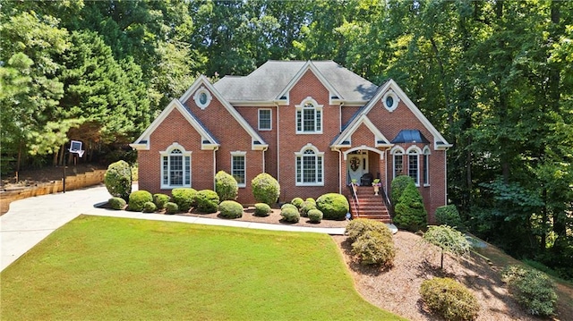 2287 Lake Ridge Ter, Lawrenceville, GA 30043 - view of front of house with a front yard and brick siding
