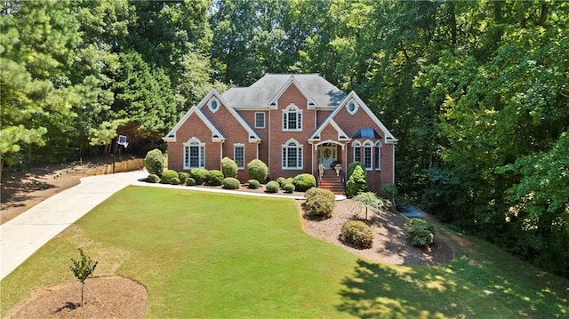 2287 Lake Ridge Ter, Lawrenceville, GA 30043 - view of front of house featuring brick siding and a front lawn