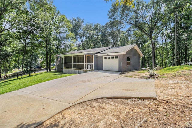 7002 Spout Springs Rd, Flowery Branch, GA 30542 - view of front of house featuring a sunroom, an attached garage, driveway, and a front lawn