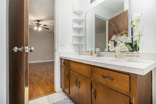 7002 Spout Springs Rd, Flowery Branch, GA 30542 - bathroom with vanity, a textured ceiling, and ceiling fan
