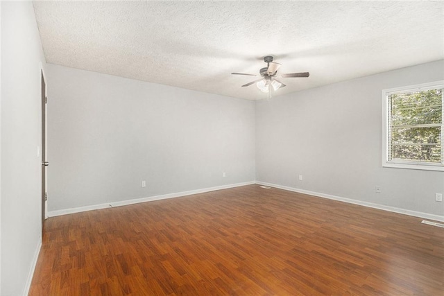 7002 Spout Springs Rd, Flowery Branch, GA 30542 - unfurnished room with ceiling fan, wood finished floors, and a textured ceiling