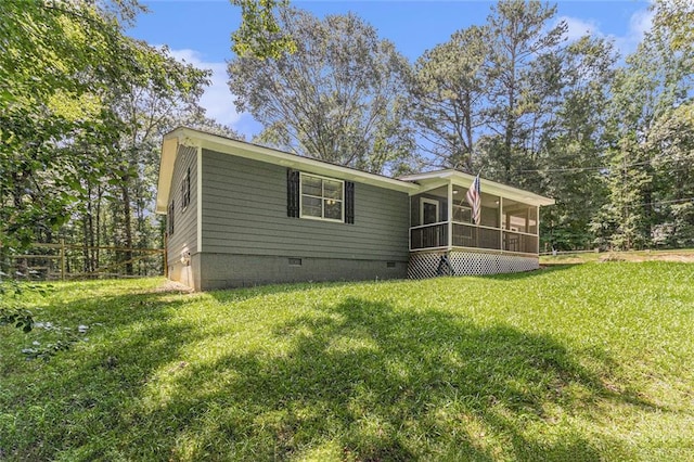 7002 Spout Springs Rd, Flowery Branch, GA 30542 - rear view of property with a sunroom, crawl space, and a lawn