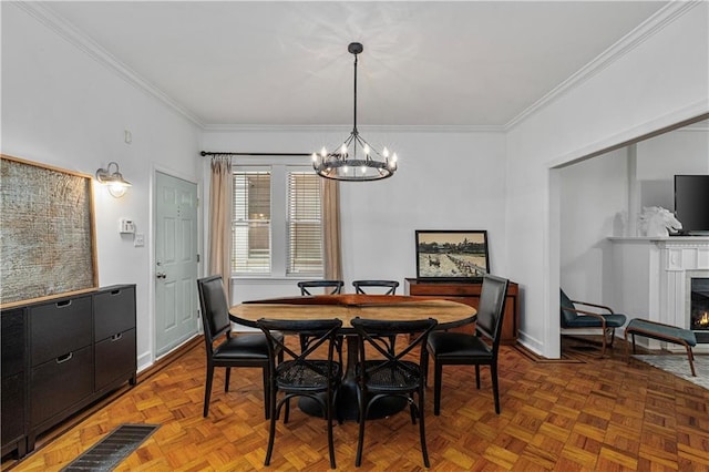 872 Briarcliff Rd NE Unit B2, Atlanta, GA 30306 - dining area featuring a chandelier, ornamental molding, and a warm lit fireplace