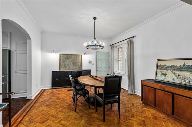 872 Briarcliff Rd NE Unit B2, Atlanta, GA 30306 - dining area with ornamental molding, arched walkways, and a chandelier