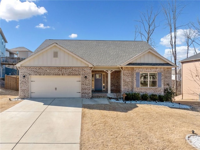 view of front of house with an attached garage, brick siding, fence, driveway, and roof with shingles