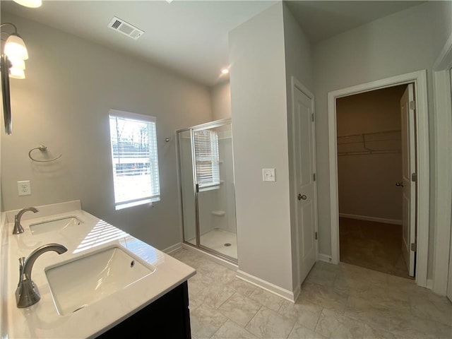 bathroom featuring vanity and walk in shower