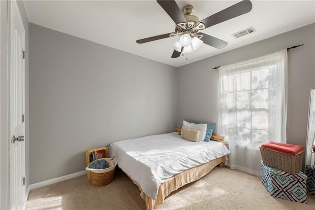 bedroom with visible vents, ceiling fan, carpet, and baseboards