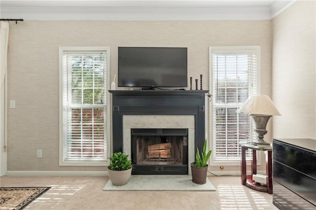 interior details featuring baseboards, crown molding, a high end fireplace, and carpet