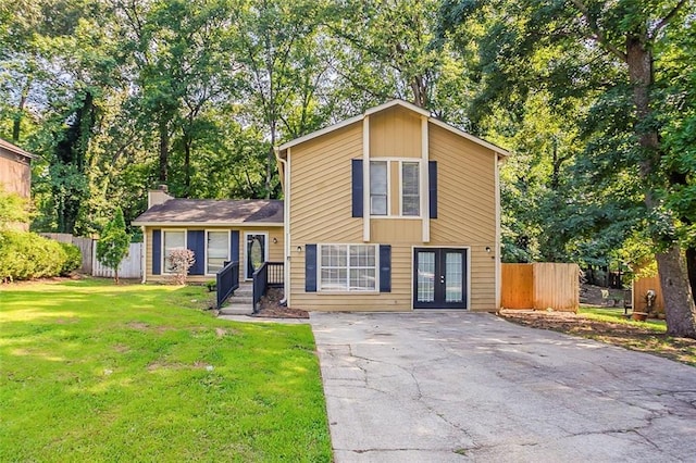 5383 Forest E Ln, Stone Mountain, GA 30088 - view of front of home featuring french doors, driveway, and a chimney