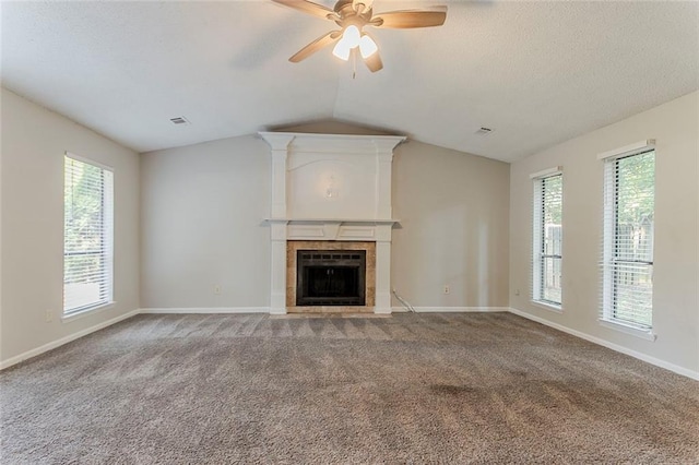 5383 Forest E Ln, Stone Mountain, GA 30088 - unfurnished living room featuring carpet, lofted ceiling, a ceiling fan, a fireplace, and healthy amount of natural light