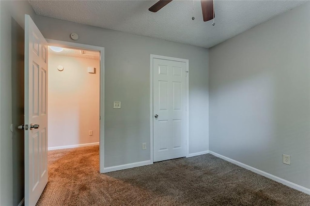 5383 Forest E Ln, Stone Mountain, GA 30088 - unfurnished bedroom with carpet floors, a textured ceiling, and a ceiling fan