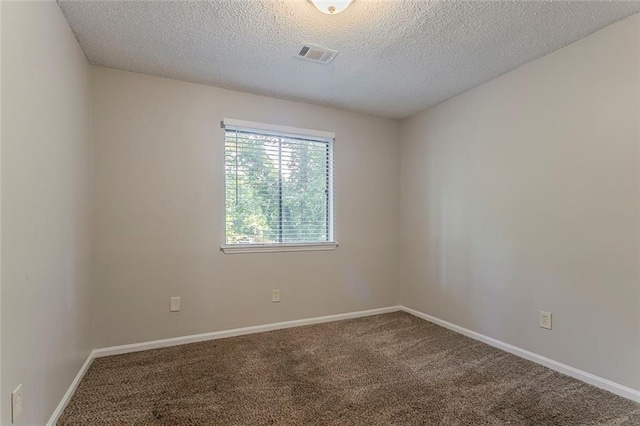 5383 Forest E Ln, Stone Mountain, GA 30088 - spare room featuring a textured ceiling and carpet flooring
