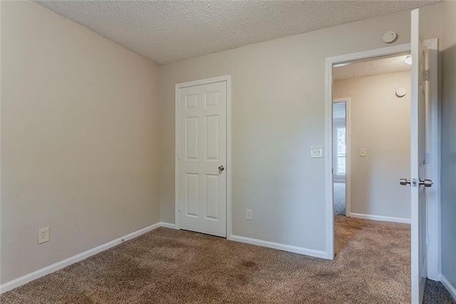 5383 Forest E Ln, Stone Mountain, GA 30088 - unfurnished bedroom featuring carpet floors and a textured ceiling