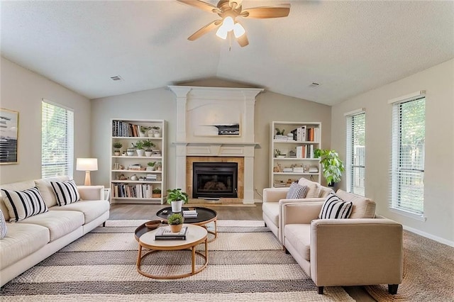 5383 Forest E Ln, Stone Mountain, GA 30088 - living area with a fireplace, vaulted ceiling, and ceiling fan