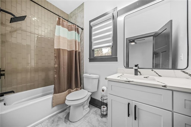 full bath featuring vanity, toilet, baseboards, and shower / bath combo