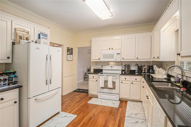 1644 Beaver Creek Ln, Snellville, GA 30078 - kitchen featuring white appliances, a sink, ornamental molding, white cabinets, and tasteful backsplash