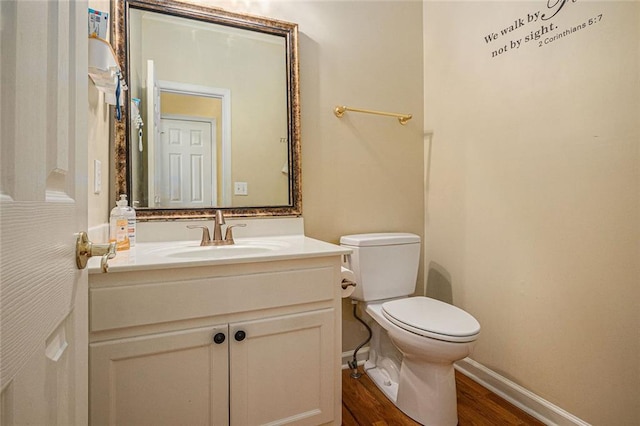 1644 Beaver Creek Ln, Snellville, GA 30078 - bathroom featuring wood finished floors, toilet, vanity, and baseboards