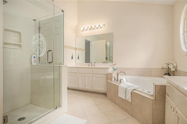 1644 Beaver Creek Ln, Snellville, GA 30078 - full bathroom featuring vanity, a stall shower, a garden tub, and tile patterned floors