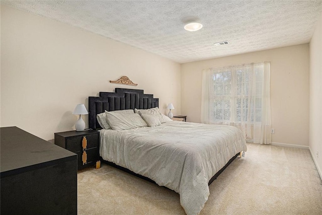 1644 Beaver Creek Ln, Snellville, GA 30078 - bedroom featuring light carpet, a textured ceiling, and baseboards