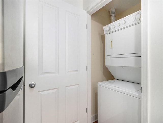 washroom with laundry area and stacked washing maching and dryer