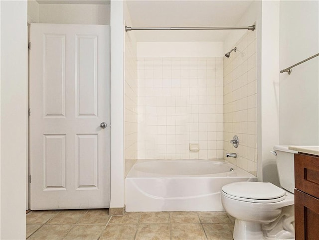 bathroom featuring tile patterned floors, toilet, vanity, and shower / bath combination