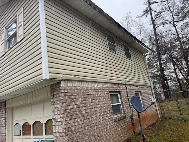 view of side of property with a garage