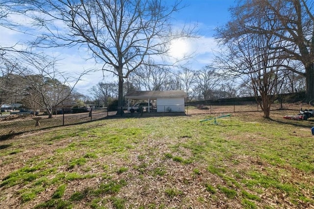 view of yard featuring fence and a rural view