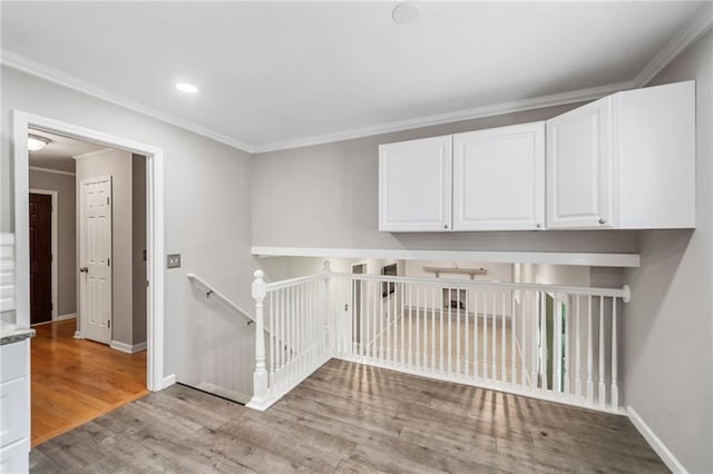 2941 Foothill Trl, Marietta, GA 30066 - hall with an upstairs landing, wood finished floors, crown molding, and recessed lighting