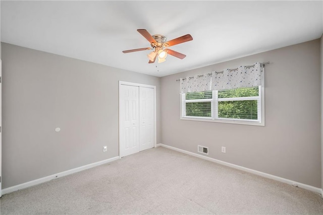 2941 Foothill Trl, Marietta, GA 30066 - unfurnished bedroom featuring light colored carpet, a closet, and a ceiling fan
