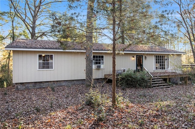 back of house featuring cooling unit