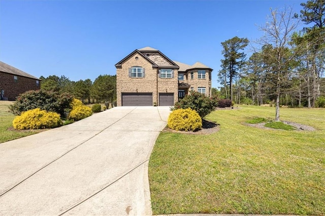 view of front facade with a garage and a front lawn