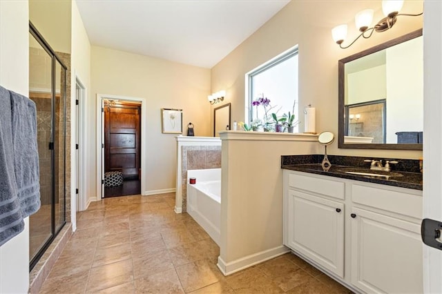 bathroom with independent shower and bath, vanity, and tile patterned floors