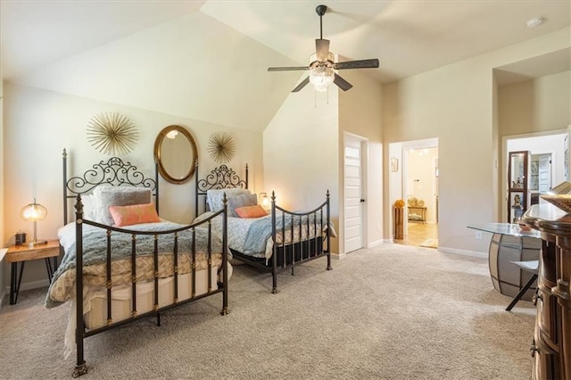 carpeted bedroom with ceiling fan and high vaulted ceiling