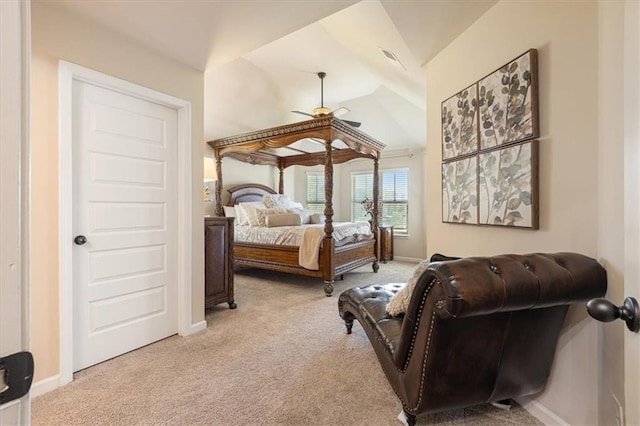 bedroom with lofted ceiling, ceiling fan, and light colored carpet