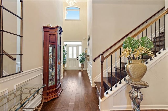 entryway featuring a notable chandelier, dark hardwood / wood-style floors, and a wealth of natural light