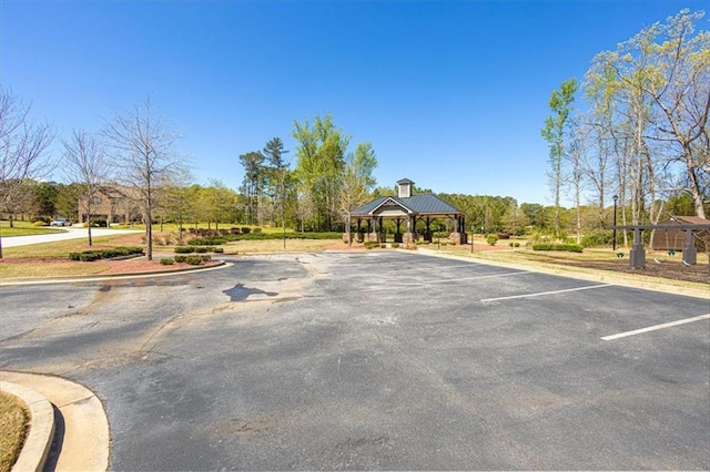 view of parking / parking lot featuring a gazebo