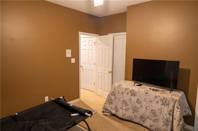 bedroom with carpet floors and baseboards