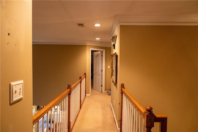 hallway with recessed lighting, light carpet, visible vents, an upstairs landing, and ornamental molding