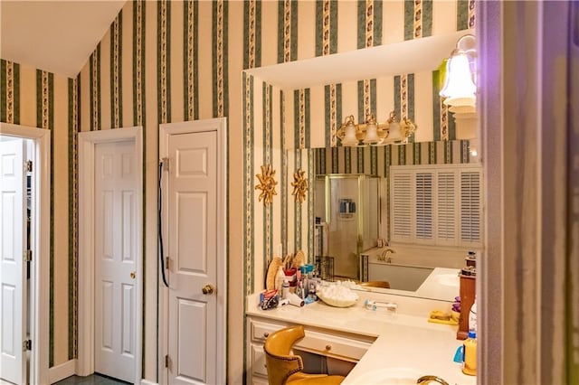 bathroom featuring wallpapered walls