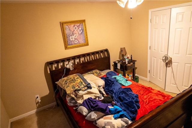 carpeted bedroom featuring baseboards