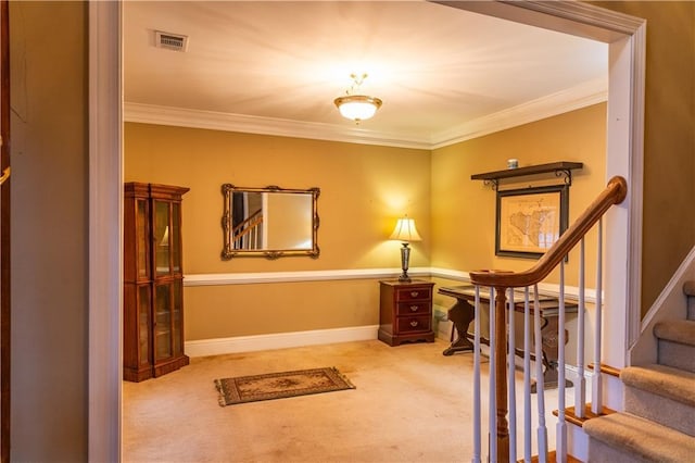 interior space featuring ornamental molding, carpet flooring, visible vents, and baseboards