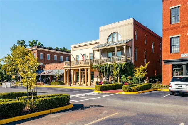 view of property with uncovered parking