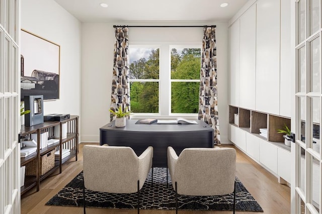 office space with light wood-style flooring and recessed lighting
