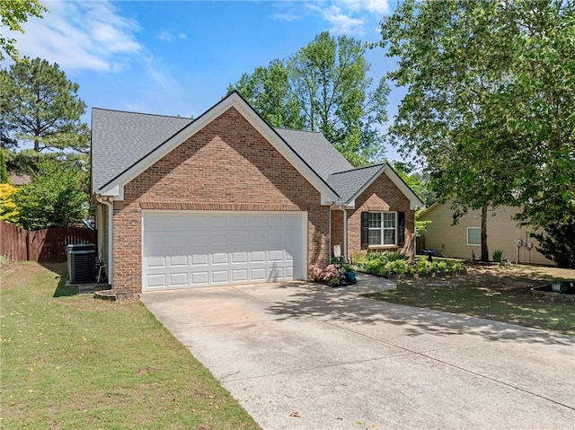 1338 Jefferson Station Rd, Jefferson, GA 30549 - ranch-style house with fence, an attached garage, brick siding, concrete driveway, and central air condition unit