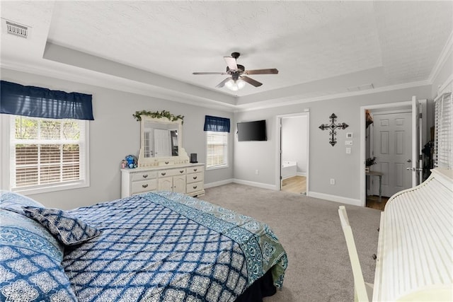 1338 Jefferson Station Rd, Jefferson, GA 30549 - carpeted bedroom with crown molding, a tray ceiling, visible vents, and baseboards
