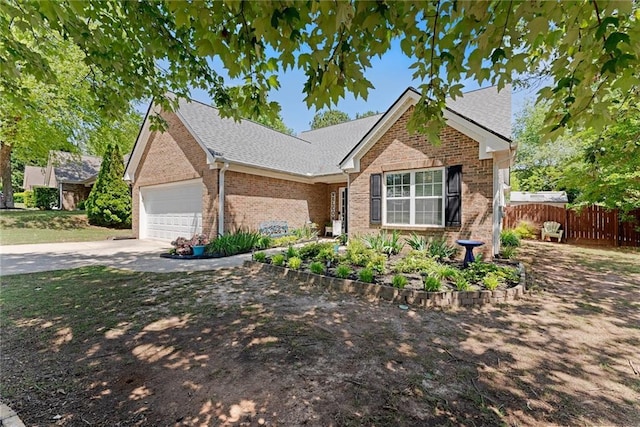 1338 Jefferson Station Rd, Jefferson, GA 30549 - ranch-style home with fence, brick siding, a shingled roof, concrete driveway, and an attached garage