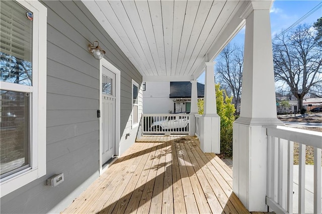 wooden deck featuring covered porch