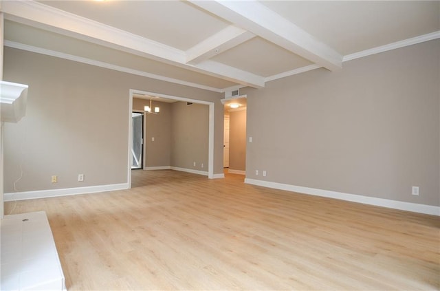 spare room with light wood-style flooring, baseboards, beamed ceiling, and ornamental molding