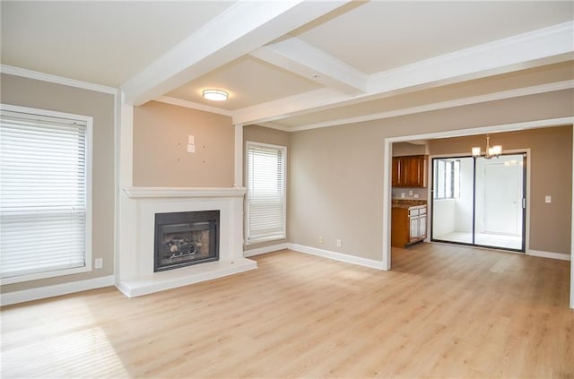 unfurnished living room featuring light wood finished floors, baseboards, and a fireplace with raised hearth